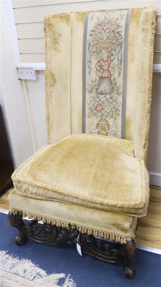 A pair of late 19th century Flemish walnut wingback chairs, W.2ft 4in. H.3ft 11in.